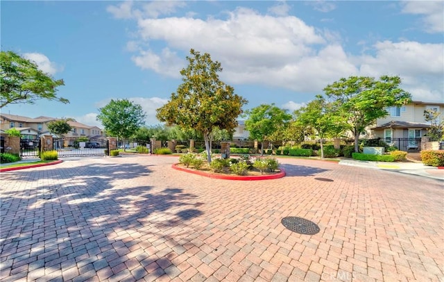 1330 W Marigold Ave, La Habra, CA 90631 - view of community featuring a gate, a residential view, and curved driveway