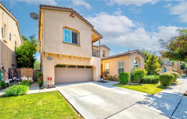 1330 W Marigold Ave, La Habra, CA 90631 - mediterranean / spanish-style home featuring a garage, stucco siding, a balcony, driveway, and a tiled roof