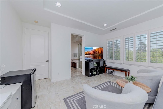 1330 W Marigold Ave, La Habra, CA 90631 - living area with healthy amount of natural light, a tray ceiling, recessed lighting, and baseboards