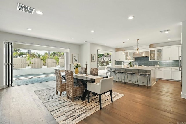 939 Moonstone Ct, Encinitas, CA 92024 - dining room with hardwood / wood-style floors and recessed lighting