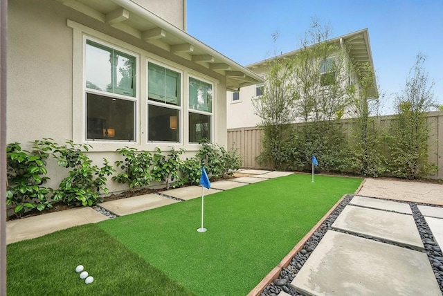 939 Moonstone Ct, Encinitas, CA 92024 - fenced backyard featuring a putting area