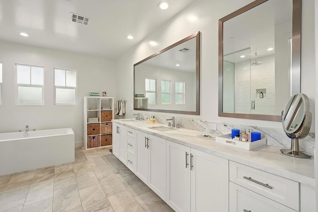 939 Moonstone Ct, Encinitas, CA 92024 - full bath featuring a freestanding tub, a stall shower, double vanity, and recessed lighting