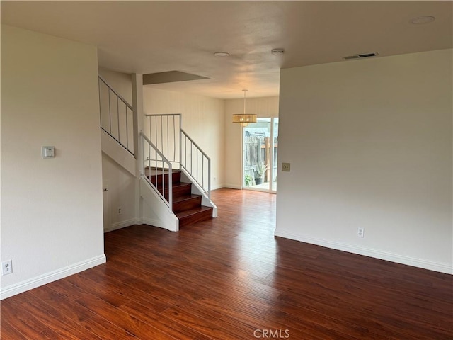 8537 Edgebrook Dr, Garden Grove, CA 92844 - empty room featuring a chandelier, stairway, wood finished floors, and baseboards