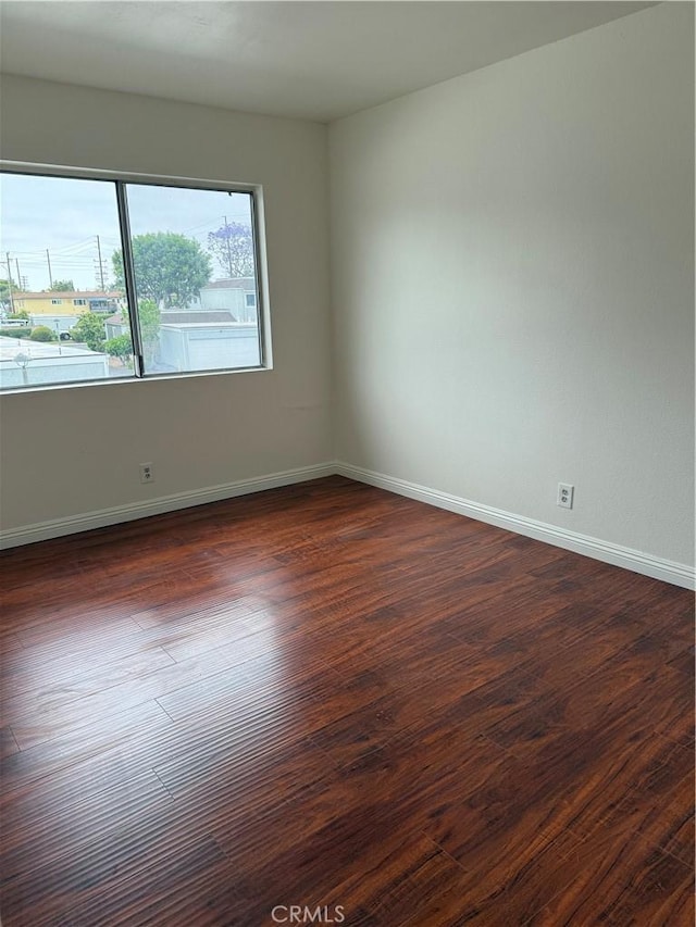 8537 Edgebrook Dr, Garden Grove, CA 92844 - empty room with dark wood finished floors and baseboards
