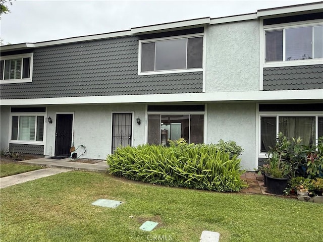 8537 Edgebrook Dr, Garden Grove, CA 92844 - townhome / multi-family property with stucco siding and a front yard