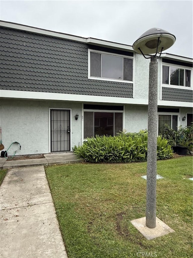 8537 Edgebrook Dr, Garden Grove, CA 92844 - townhome / multi-family property with stucco siding and a front lawn