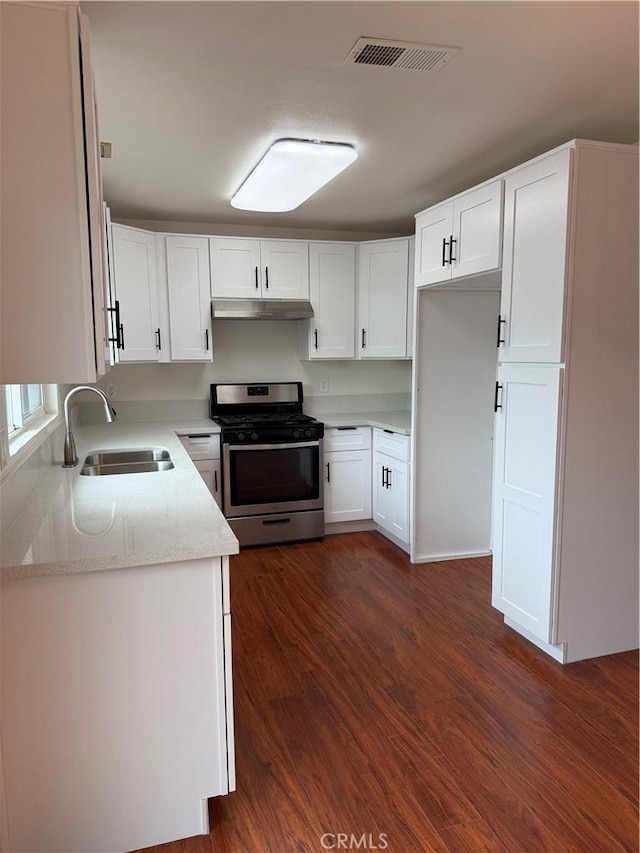 8537 Edgebrook Dr, Garden Grove, CA 92844 - kitchen featuring stainless steel gas stove, a sink, under cabinet range hood, and white cabinets
