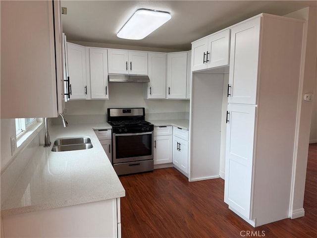 8537 Edgebrook Dr, Garden Grove, CA 92844 - kitchen featuring stainless steel gas range oven, under cabinet range hood, a sink, dark wood-style floors, and white cabinets