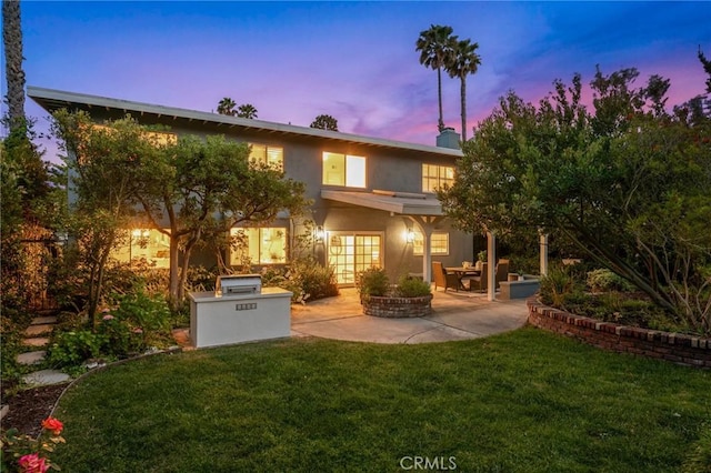 4947 Blackhorse Rd, Rancho Palos Verdes, CA 90275 - rear view of property featuring a patio, a lawn, stucco siding, a chimney, and an outdoor kitchen