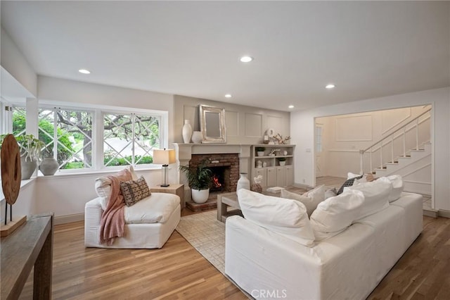 4947 Blackhorse Rd, Rancho Palos Verdes, CA 90275 - living room with light wood-style flooring, a fireplace, recessed lighting, stairs, and baseboards