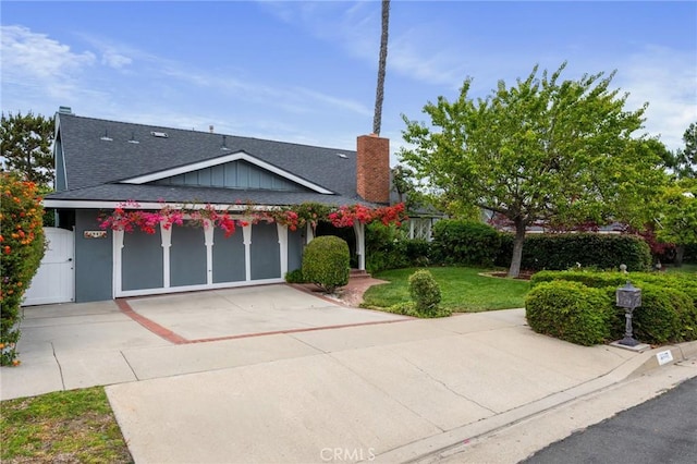 4947 Blackhorse Rd, Rancho Palos Verdes, CA 90275 - view of front of home with driveway, a chimney, a front yard, a shingled roof, and an attached garage