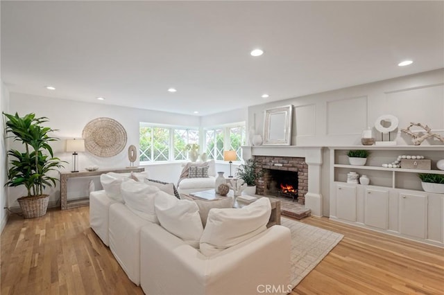 4947 Blackhorse Rd, Rancho Palos Verdes, CA 90275 - living area featuring light wood-style flooring, a fireplace, and recessed lighting