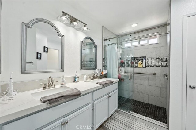 293 Belize Way, Oceanside, CA 92057 - full bathroom featuring a shower stall and double vanity