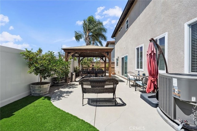 293 Belize Way, Oceanside, CA 92057 - fenced backyard with a gazebo, central AC unit, outdoor dining space, and a patio area