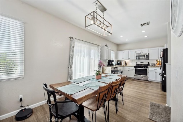 293 Belize Way, Oceanside, CA 92057 - dining space featuring plenty of natural light, light wood-type flooring, baseboards, and recessed lighting