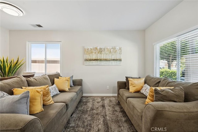 293 Belize Way, Oceanside, CA 92057 - carpeted living room featuring baseboards and plenty of natural light