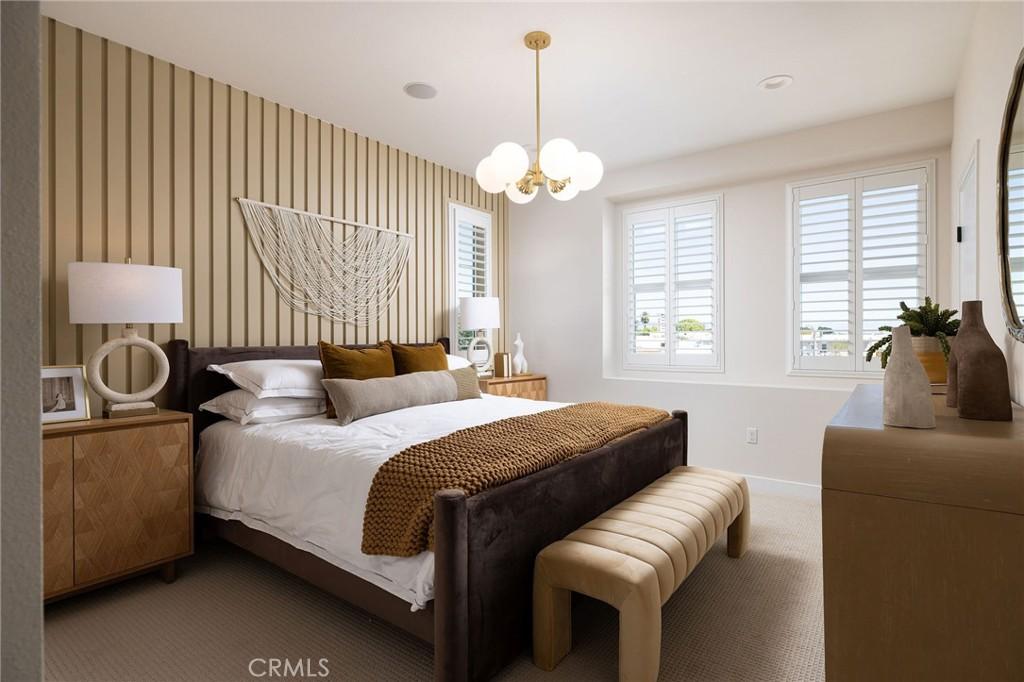 119 N First Ave, Upland, CA 91786 - bedroom featuring baseboards, a chandelier, and carpet flooring