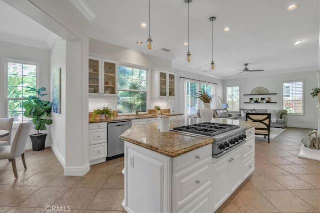 10 Edendale St, Ladera Ranch, CA 92694 - kitchen featuring stainless steel appliances, crown molding, a ceiling fan, baseboards, and light stone countertops