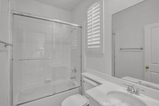 10 Edendale St, Ladera Ranch, CA 92694 - bathroom featuring toilet, shower / bath combination with glass door, and vanity