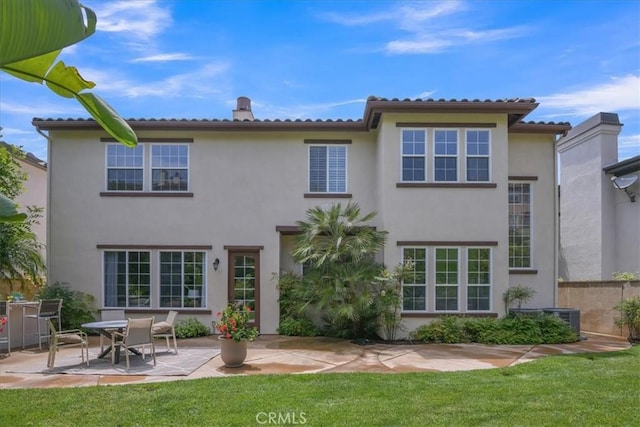 10 Edendale St, Ladera Ranch, CA 92694 - rear view of property featuring a patio area, stucco siding, and a lawn