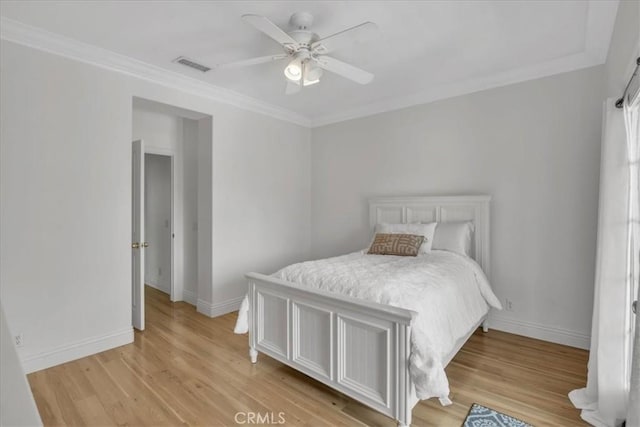 10 Edendale St, Ladera Ranch, CA 92694 - bedroom featuring crown molding, baseboards, light wood-style floors, and ceiling fan