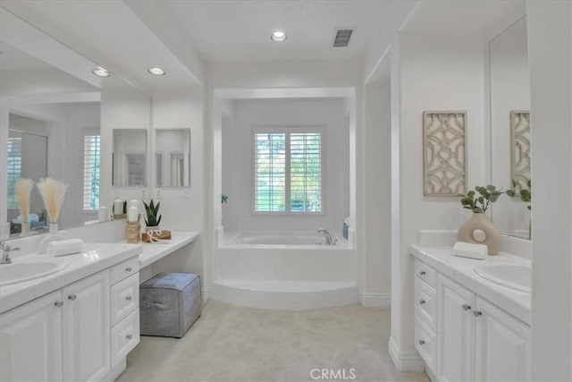 10 Edendale St, Ladera Ranch, CA 92694 - bathroom featuring two vanities, a garden tub, and recessed lighting