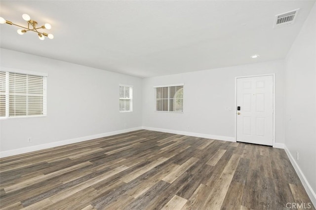 42192 Delmonte St, Temecula, CA 92591 - unfurnished room with dark wood-type flooring, baseboards, a chandelier, and recessed lighting