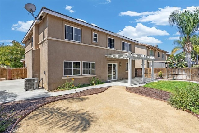 42192 Delmonte St, Temecula, CA 92591 - back of house featuring a pergola, a patio, stucco siding, and central AC unit