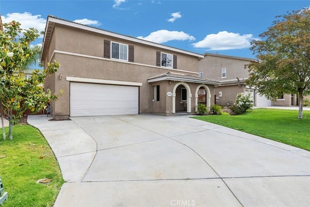42192 Delmonte St, Temecula, CA 92591 - mediterranean / spanish house featuring stucco siding, an attached garage, driveway, and a front yard