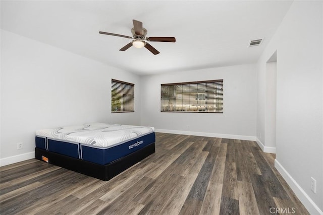 42192 Delmonte St, Temecula, CA 92591 - bedroom with dark wood-style flooring, baseboards, and ceiling fan