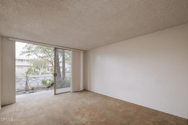 1000 Cordova St Unit 103, Pasadena, CA 91106 - spare room with carpet and a textured ceiling