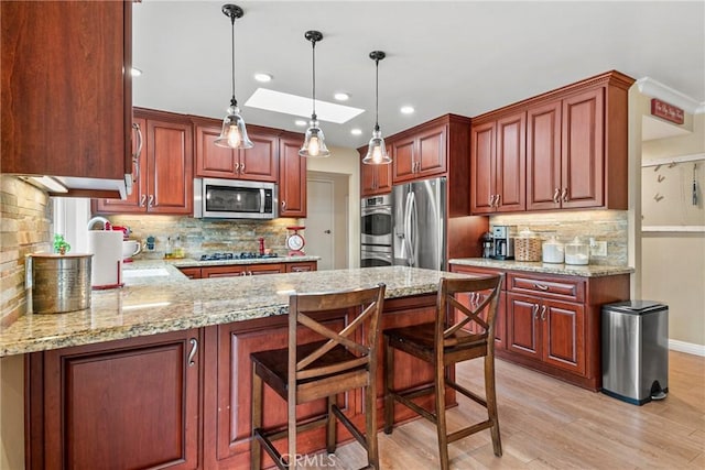 1528 E San Alto Ave, Orange, CA 92865 - kitchen with stainless steel appliances, tasteful backsplash, a peninsula, light wood-type flooring, and recessed lighting