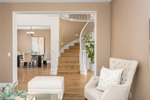 2437 N Eaton Ct, Orange, CA 92867 - living area featuring stairs, wood finished floors, and a chandelier