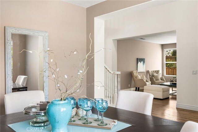 2437 N Eaton Ct, Orange, CA 92867 - dining area featuring wood finished floors and stairway