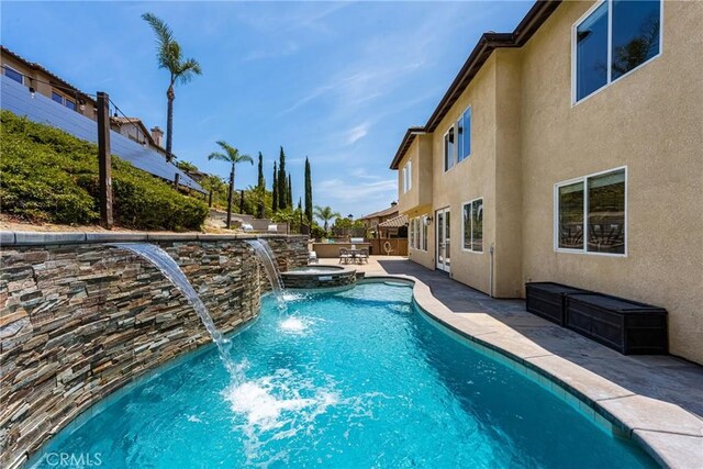 2437 N Eaton Ct, Orange, CA 92867 - view of swimming pool featuring a patio area and a pool with connected hot tub
