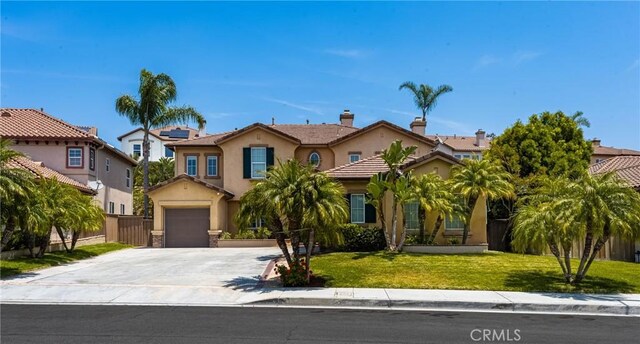 2437 N Eaton Ct, Orange, CA 92867 - view of front facade featuring driveway, stucco siding, a tile roof, and a residential view