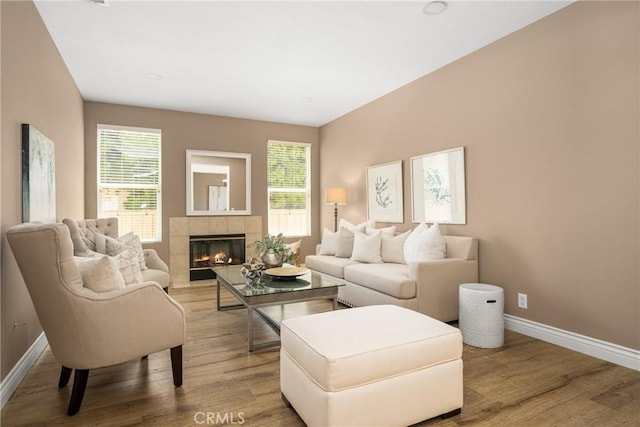2437 N Eaton Ct, Orange, CA 92867 - living room with wood finished floors and a tile fireplace