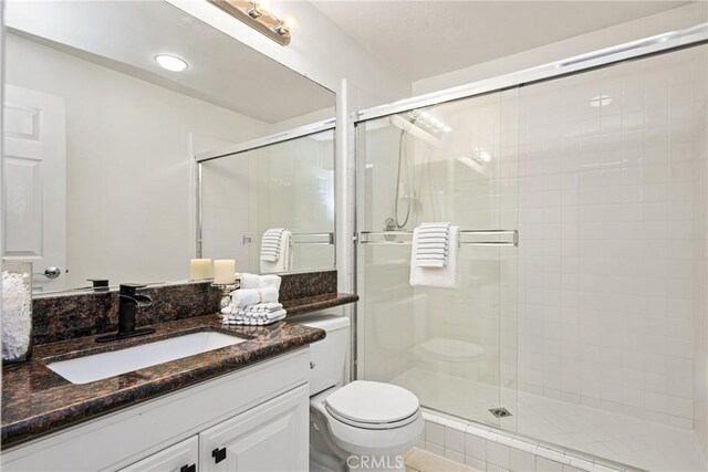 2437 N Eaton Ct, Orange, CA 92867 - bathroom with vanity and a stall shower
