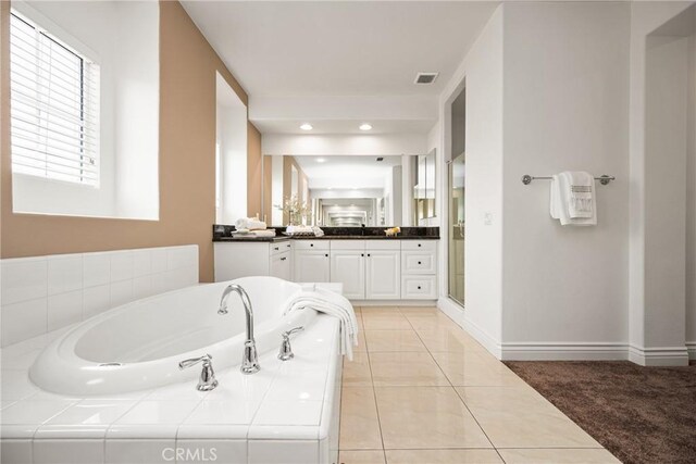 2437 N Eaton Ct, Orange, CA 92867 - full bath featuring vanity, a bath, tile patterned floors, and a shower stall