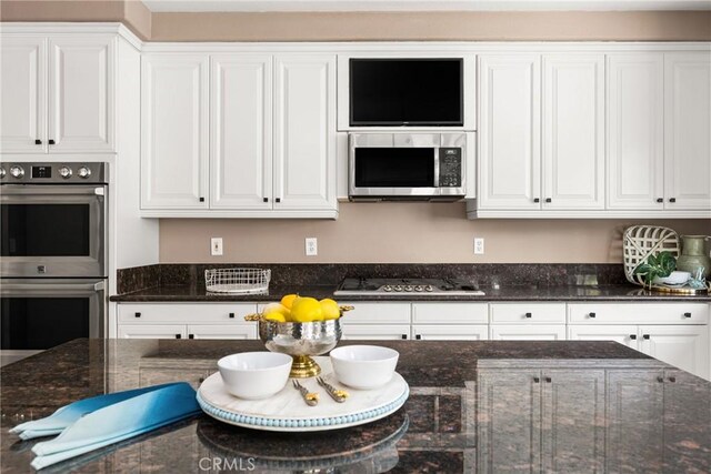 2437 N Eaton Ct, Orange, CA 92867 - kitchen featuring appliances with stainless steel finishes and white cabinets