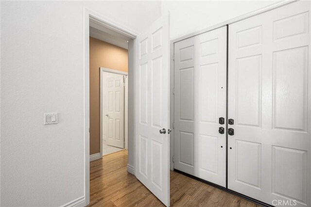 2437 N Eaton Ct, Orange, CA 92867 - entryway featuring baseboards and wood finished floors