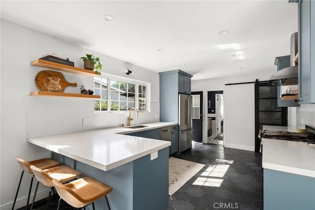 17949 Archwood St, Reseda, CA 91335 - kitchen featuring open shelves, freestanding refrigerator, a peninsula, a kitchen bar, and light countertops