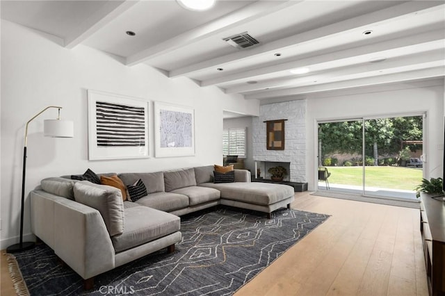 17949 Archwood St, Reseda, CA 91335 - living area featuring beam ceiling, wood finished floors, healthy amount of natural light, a fireplace, and recessed lighting