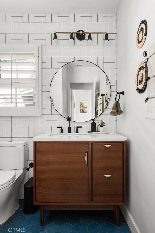 17949 Archwood St, Reseda, CA 91335 - bathroom featuring tile patterned floors, vanity, tile walls, and backsplash
