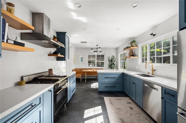 17949 Archwood St, Reseda, CA 91335 - kitchen featuring open shelves, appliances with stainless steel finishes, wall chimney range hood, blue cabinetry, and recessed lighting