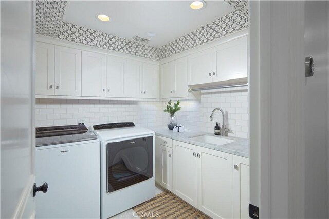 2 Royal Saint George Rd, Newport Beach, CA 92660 - washroom featuring washer and dryer, cabinet space, and recessed lighting