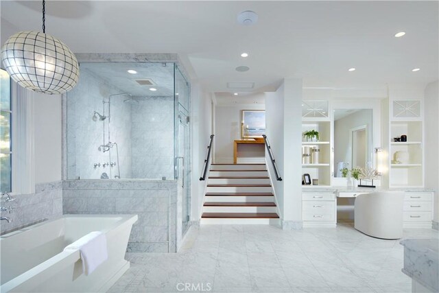 2 Royal Saint George Rd, Newport Beach, CA 92660 - full bathroom featuring a freestanding tub, a shower stall, vanity, recessed lighting, and built in shelves