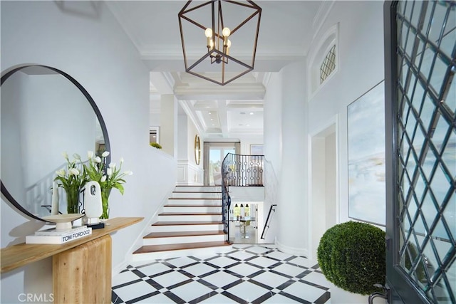 2 Royal Saint George Rd, Newport Beach, CA 92660 - foyer featuring inlaid floor details, a chandelier, stairs, and crown molding