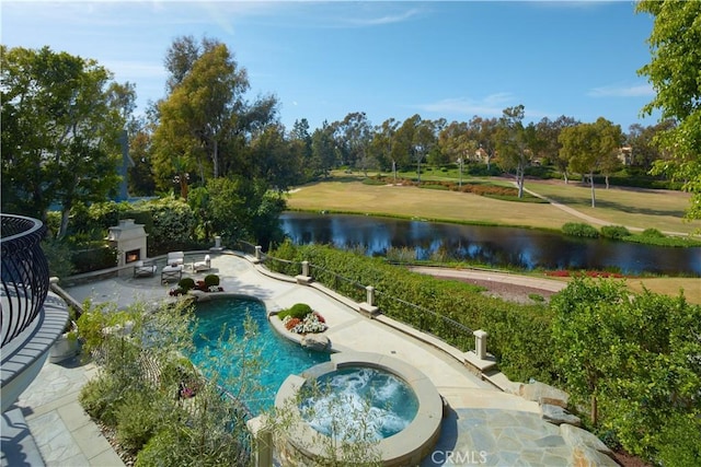 2 Royal Saint George Rd, Newport Beach, CA 92660 - view of swimming pool with a patio, a water view, a pool with connected hot tub, view of scattered trees, and a warm lit fireplace
