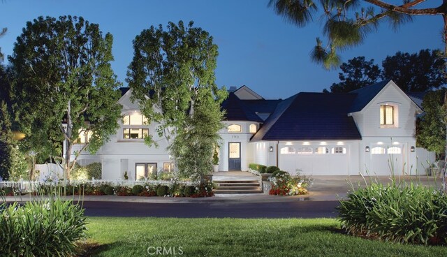 2 Royal Saint George Rd, Newport Beach, CA 92660 - view of front of house featuring an attached garage and driveway